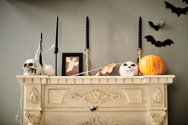 Various Halloween Paraphernalia Decorates Fireplace